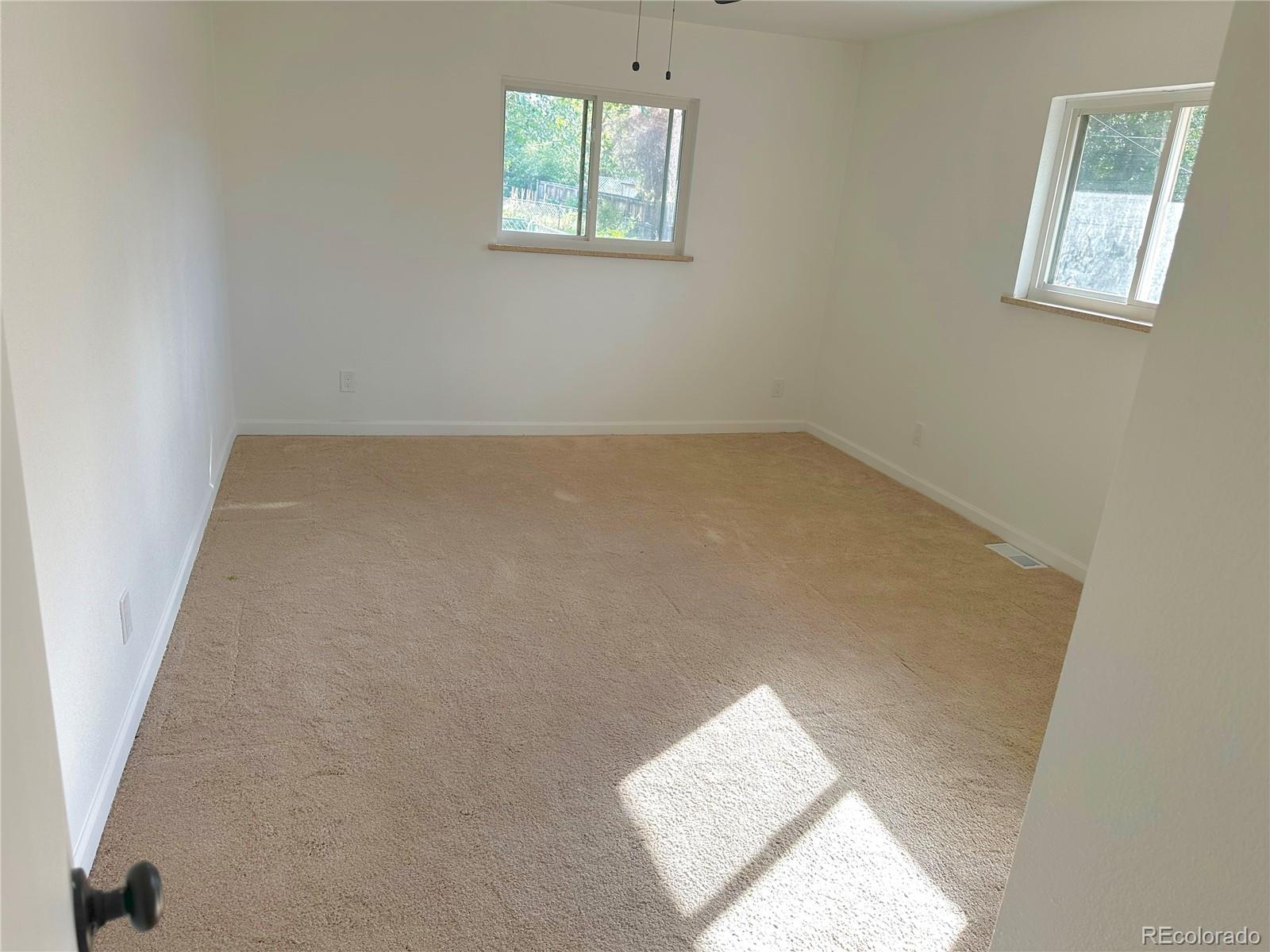 423 Empire Street Aurora, CO 80010 - Photo 26 of 44 an empty room with windows
