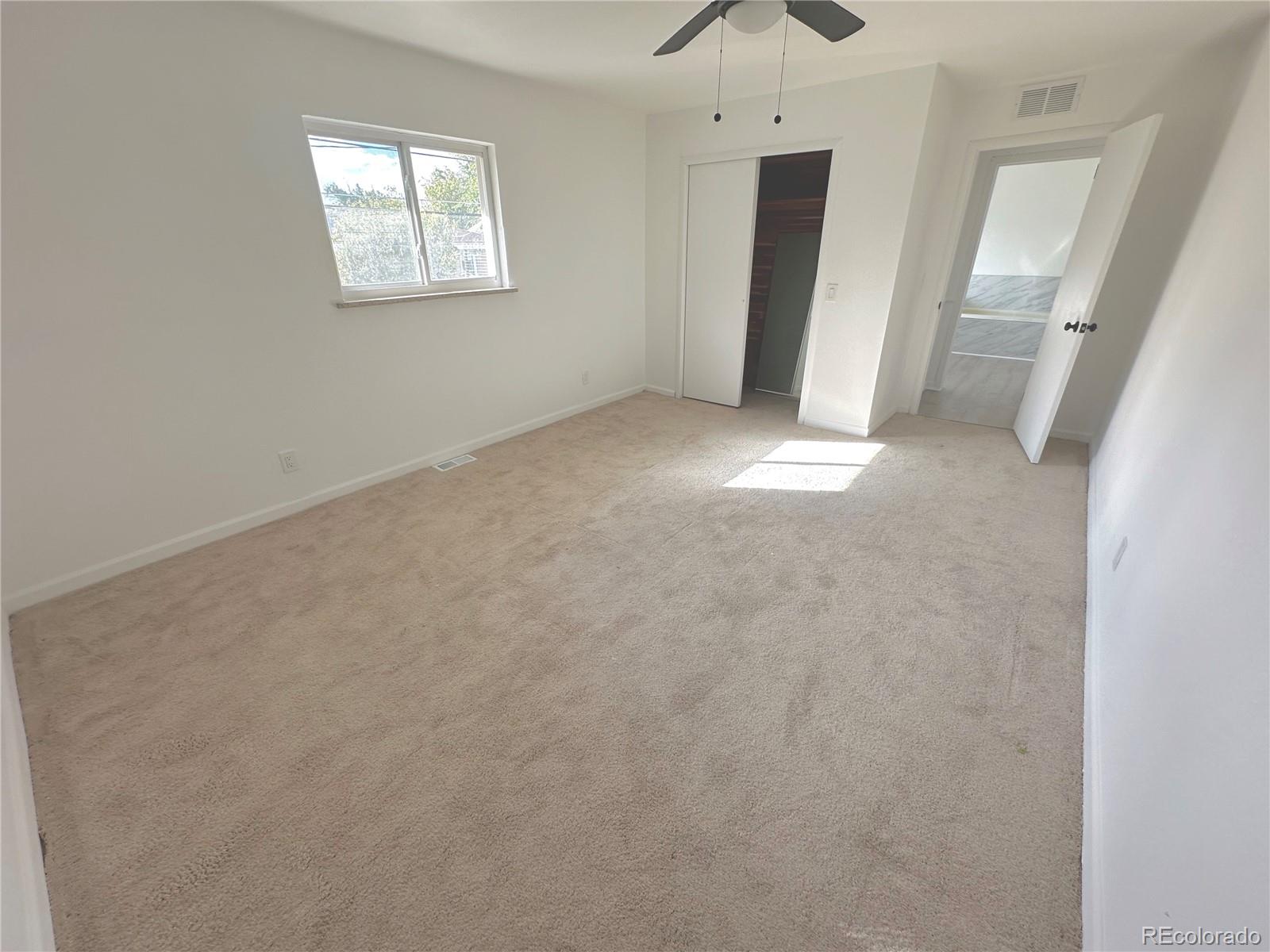 423 Empire Street Aurora, CO 80010 - Photo 27 of 44 an empty room with windows