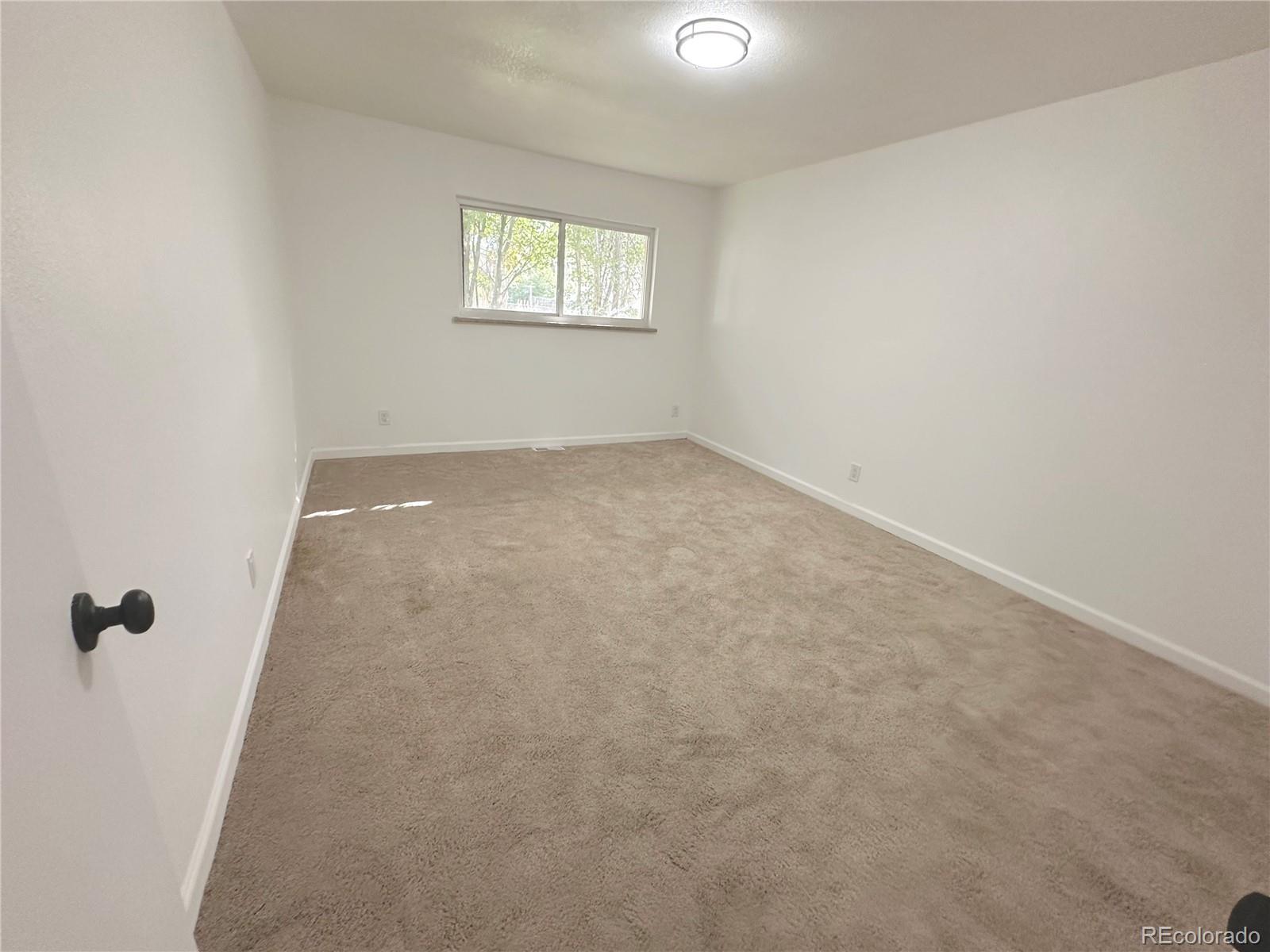 423 Empire Street Aurora, CO 80010 - Photo 28 of 44 an empty room with windows