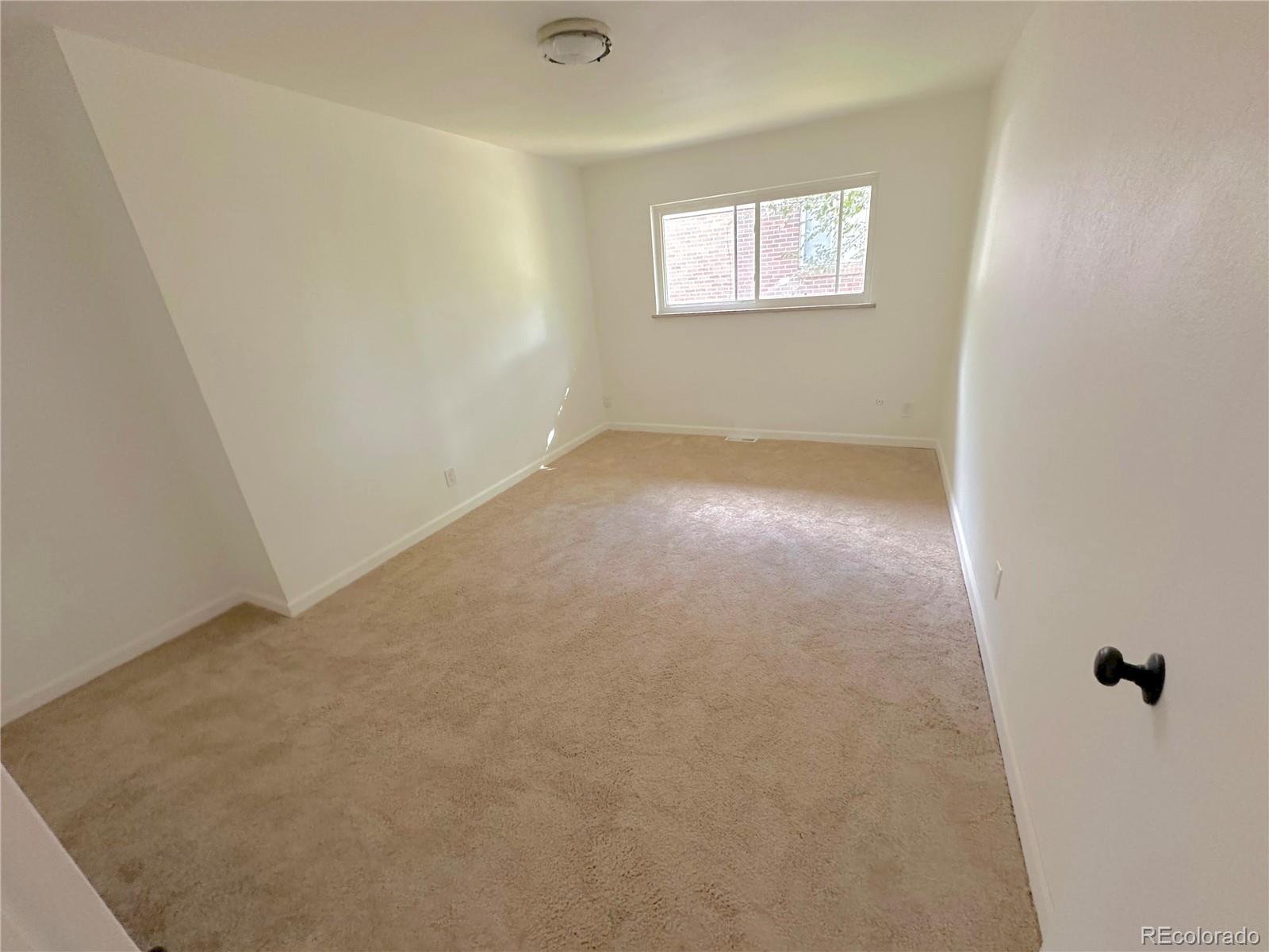 423 Empire Street Aurora, CO 80010 - Photo 30 of 44 an empty room with windows