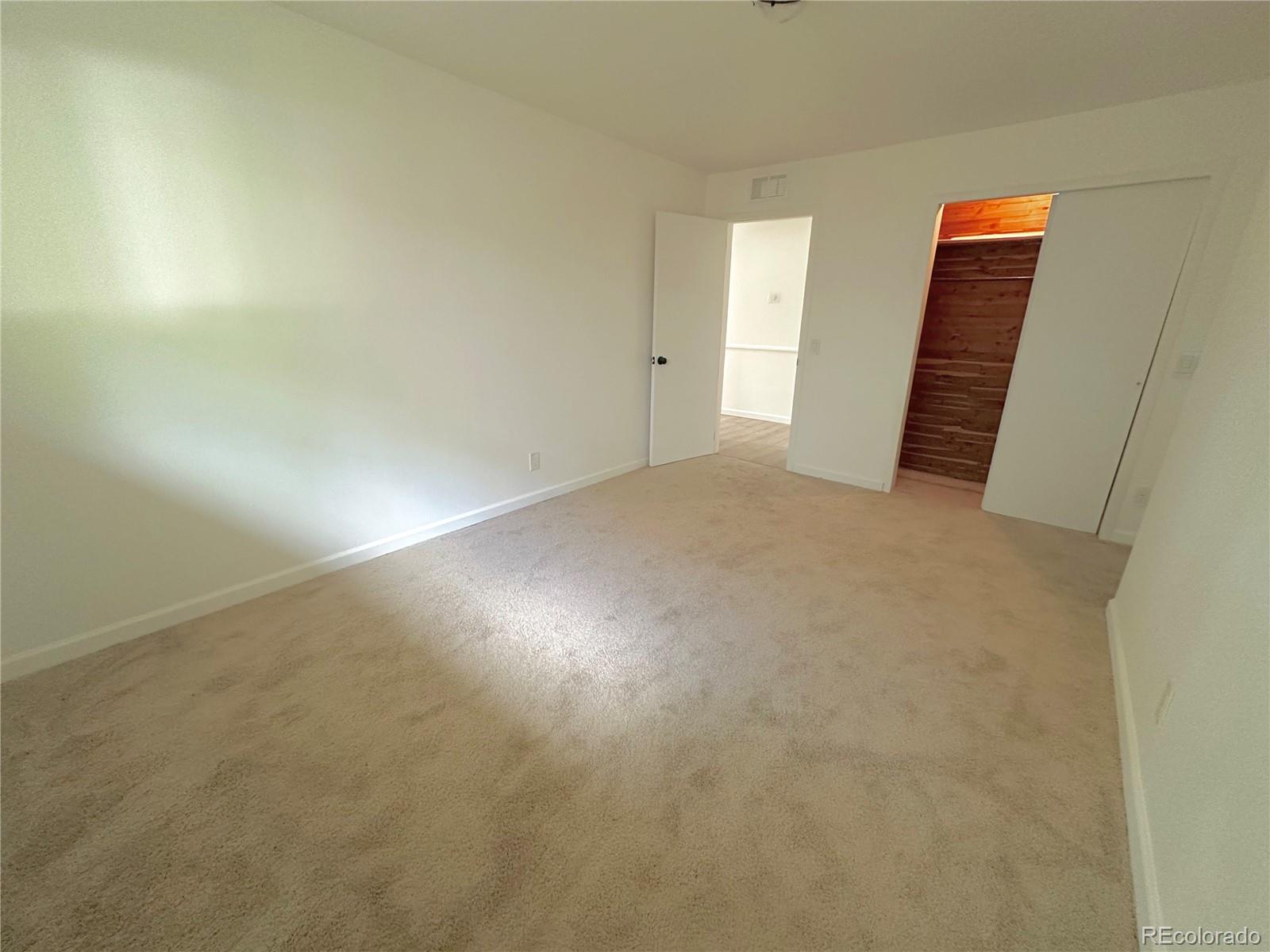 423 Empire Street Aurora, CO 80010 - Photo 32 of 44 an empty room with a bathroom