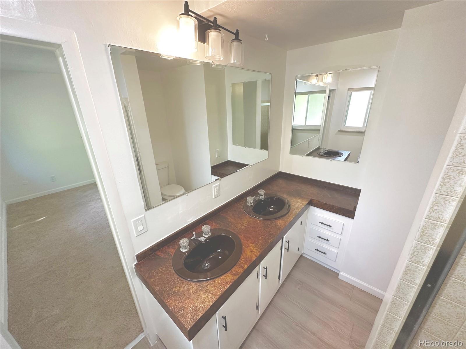 423 Empire Street Aurora, CO 80010 - Photo 39 of 44 view of living room and wooden floor