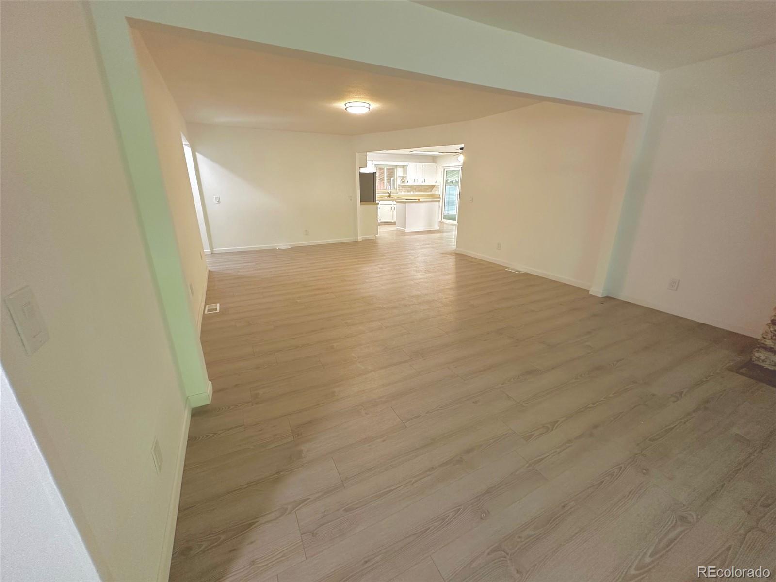 423 Empire Street Aurora, CO 80010 - Photo 41 of 44 a view of empty room with wooden floor