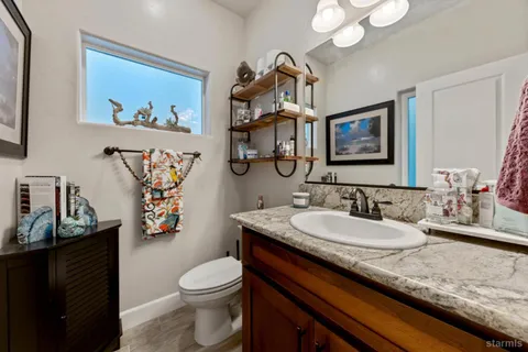 a bedroom with furniture and a chandelier