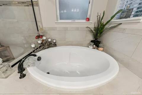 a view of a white house with a outdoor space