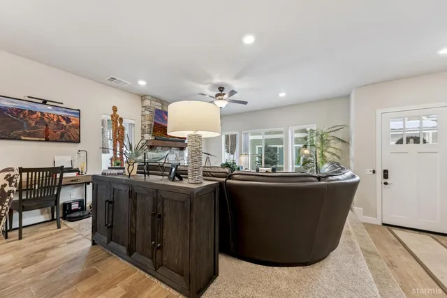a view of a kitchen with dining table and chairs