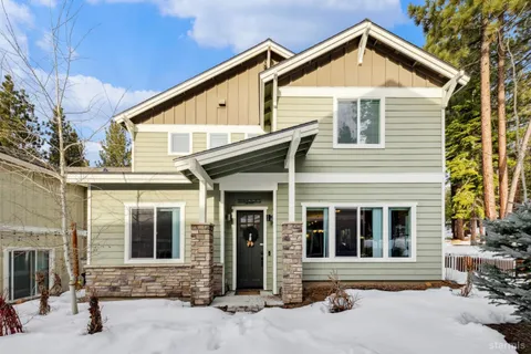 a bedroom with a large bed and a flat screen tv