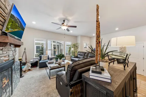 a living room with furniture fireplace and a flat screen tv