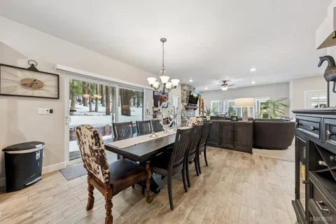 a kitchen with stainless steel appliances granite countertop a sink a stove and a wooden floors