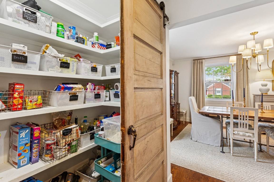 210 Cherokee Road Nashville, TN 37205 - Photo 11 of 56 a kitchen with a refrigerator and a table
