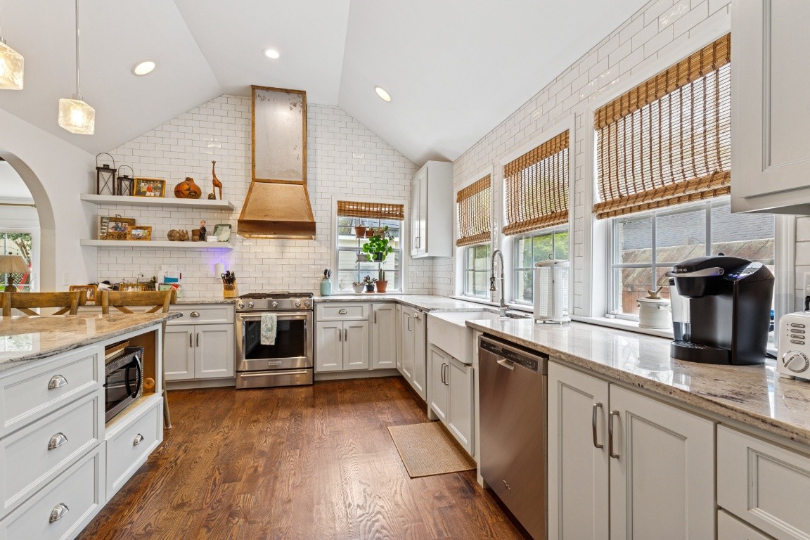 210 Cherokee Road Nashville, TN 37205 - Photo 13 of 56 a kitchen with a sink stove top oven and cabinets