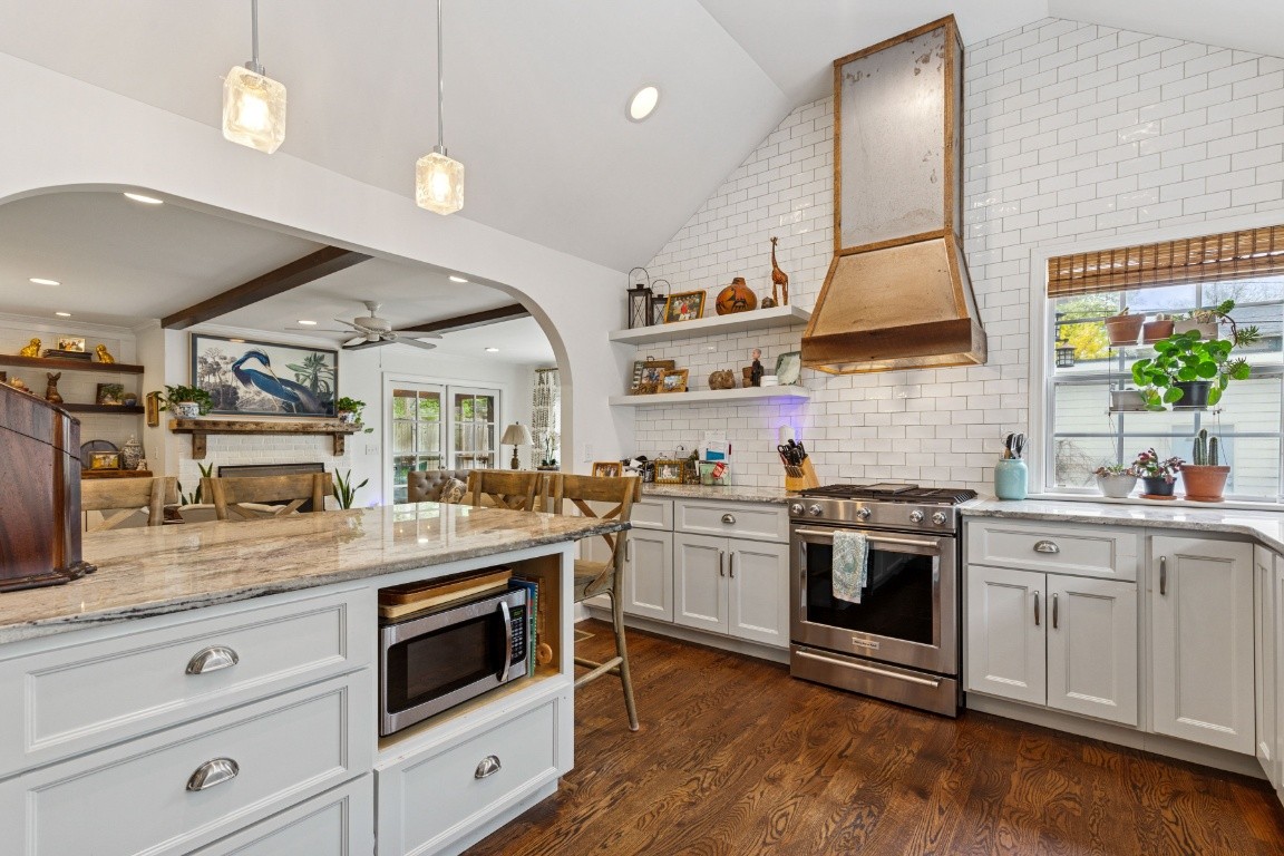 210 Cherokee Road Nashville, TN 37205 - Photo 14 of 56 a kitchen with stainless steel appliances granite countertop a stove and a sink