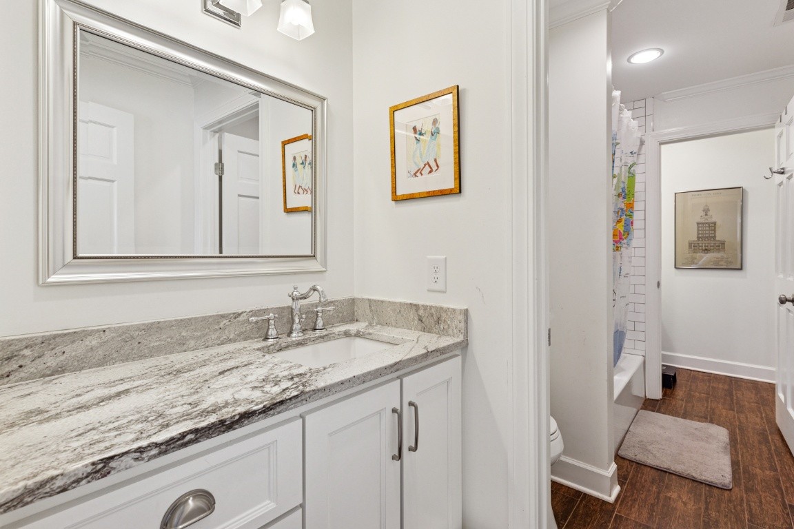 210 Cherokee Road Nashville, TN 37205 - Photo 26 of 56 a bathroom with a granite countertop sink and a mirror