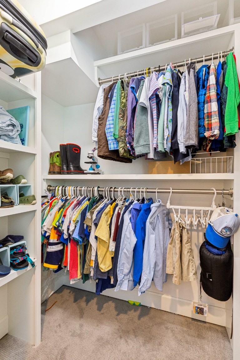 210 Cherokee Road Nashville, TN 37205 - Photo 30 of 56 a view of walk in closet with clothes and shoes