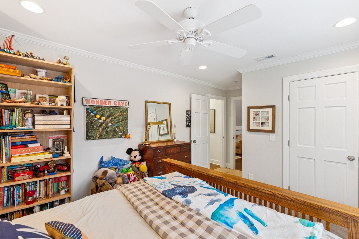 210 Cherokee Road Nashville, TN 37205 - Photo 31 of 56 a bed room with a bed and a book shelf