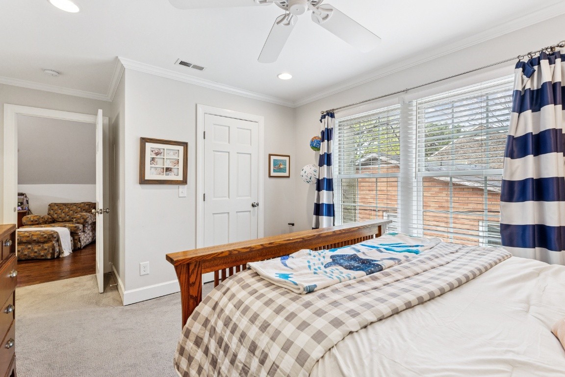 210 Cherokee Road Nashville, TN 37205 - Photo 32 of 56 a bedroom with a bed and a view of walk in closet