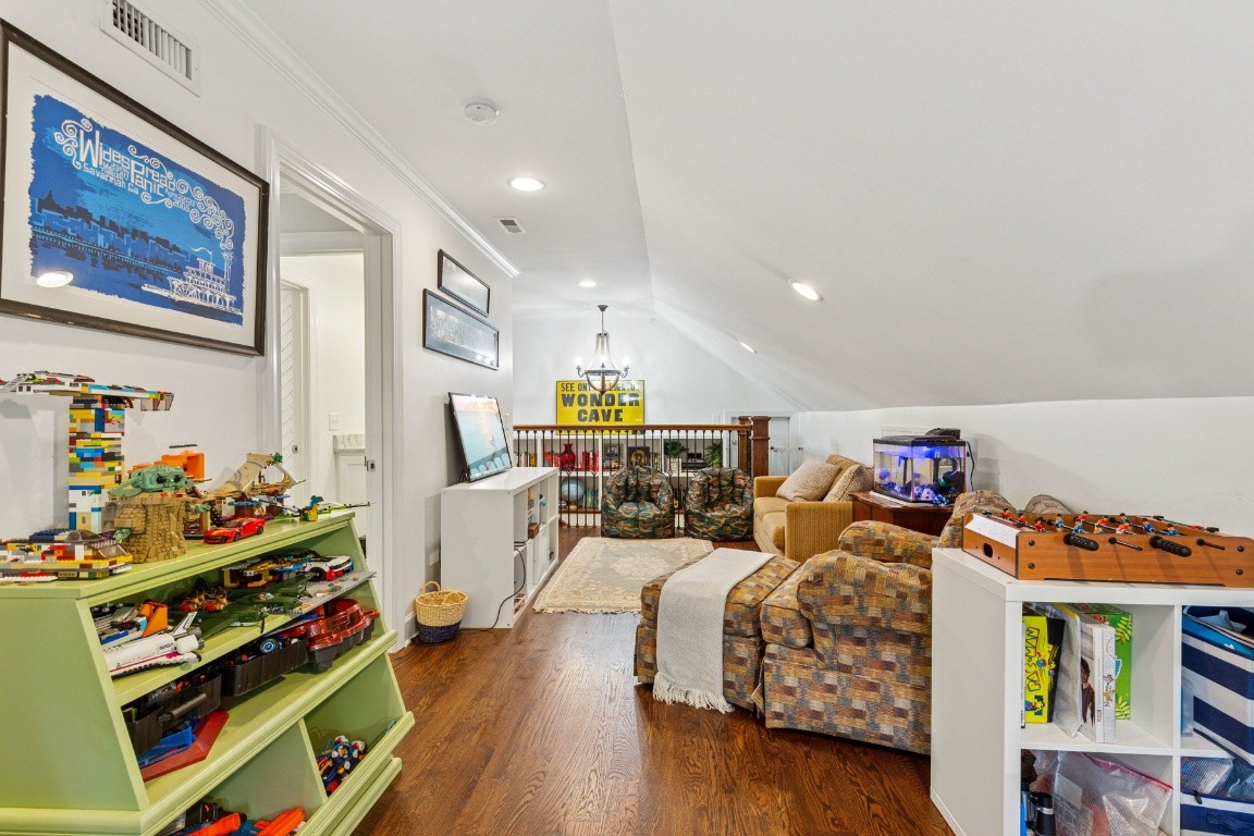 210 Cherokee Road Nashville, TN 37205 - Photo 34 of 56 a bedroom with furniture and a book shelf