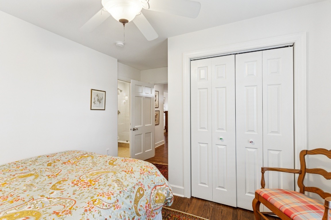 210 Cherokee Road Nashville, TN 37205 - Photo 38 of 56 a bedroom with a bed and a chair