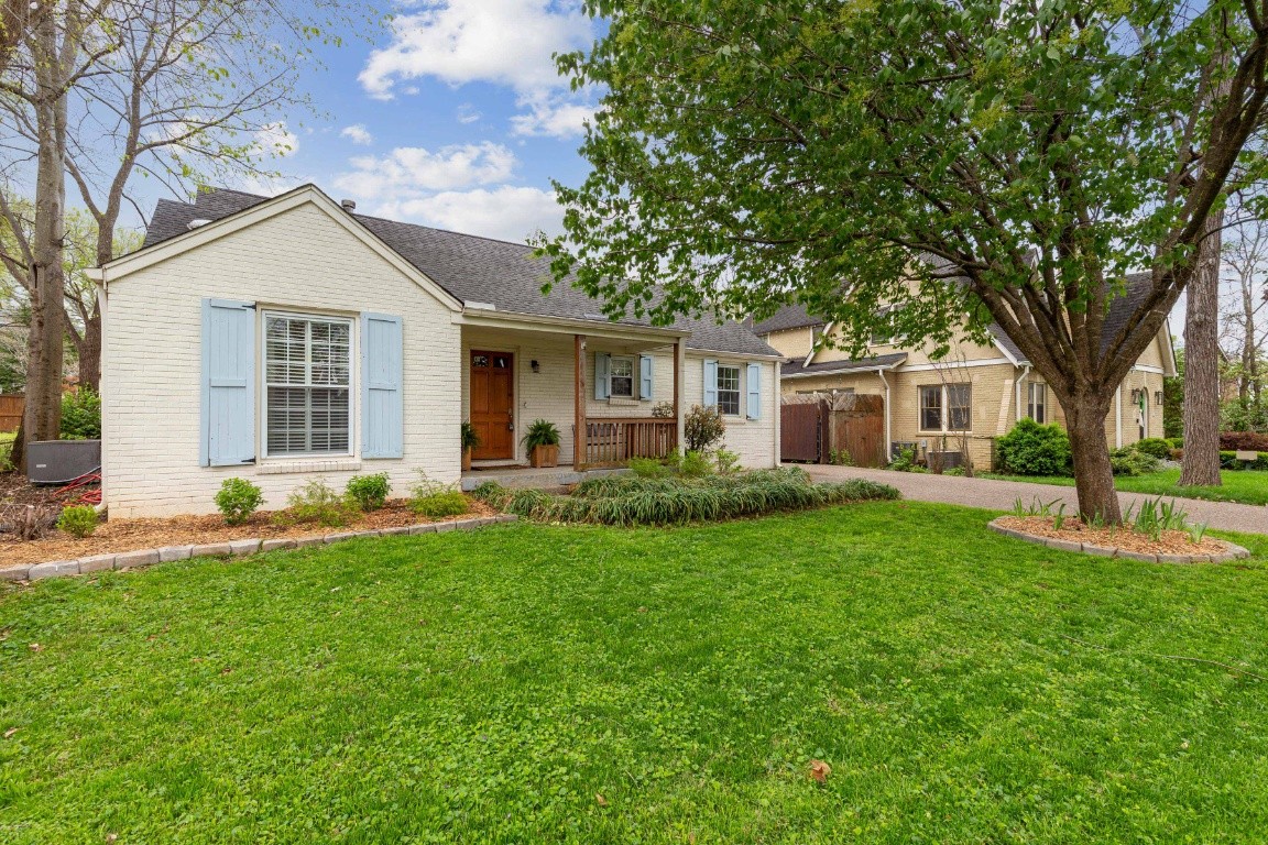 210 Cherokee Road Nashville, TN 37205 - Photo 4 of 56 a front view of house with yard and green space