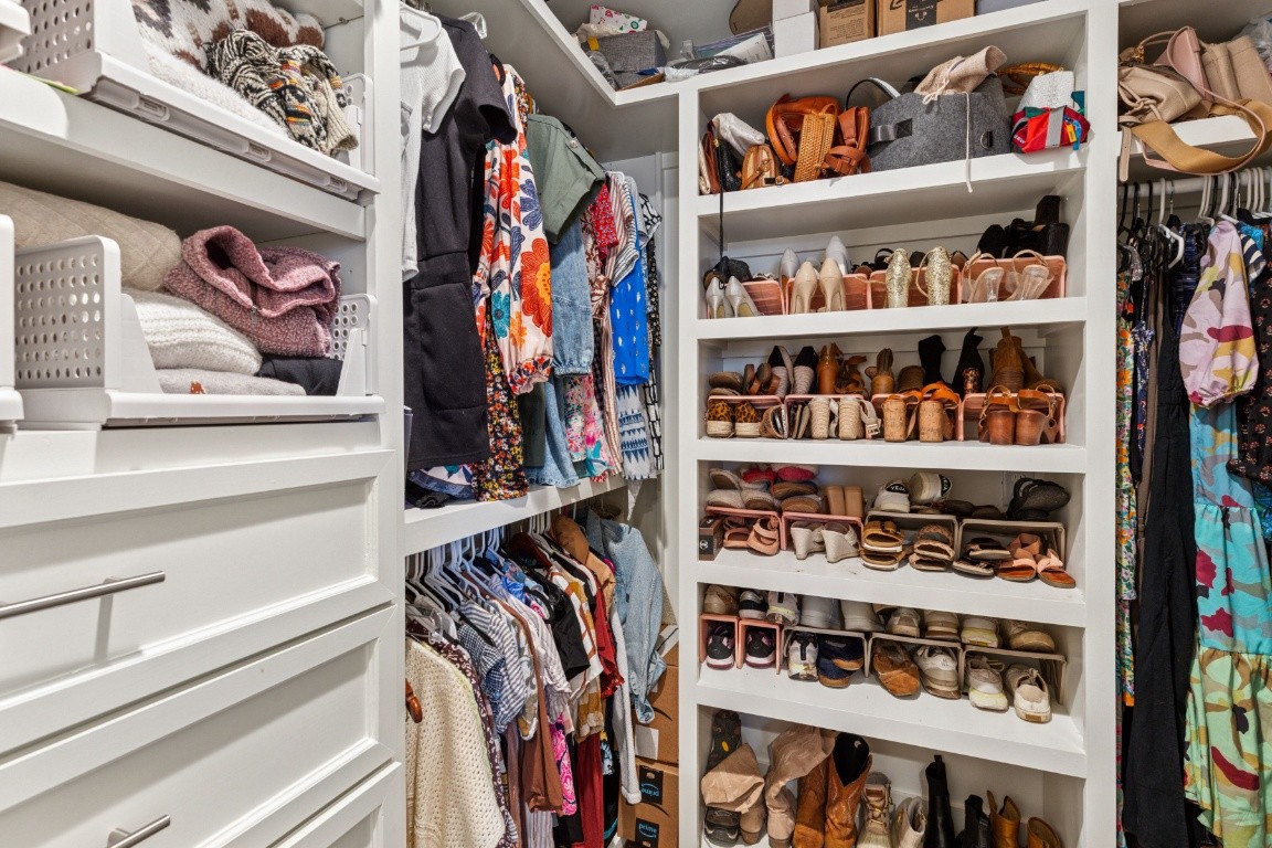 210 Cherokee Road Nashville, TN 37205 - Photo 43 of 56 a view of walk in closet with clothes and shoes