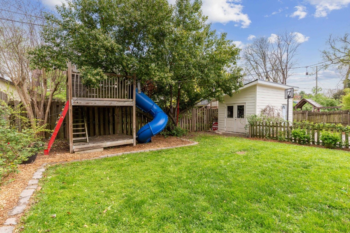 210 Cherokee Road Nashville, TN 37205 - Photo 51 of 56 a view of a house with a yard and a tree