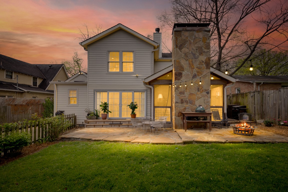 210 Cherokee Road Nashville, TN 37205 - Photo 56 of 56 a front view of a house with a yard table and chairs