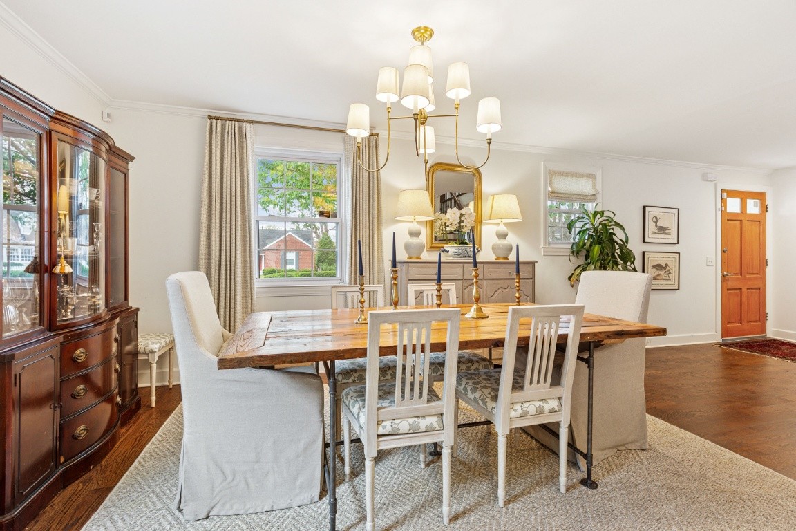 210 Cherokee Road Nashville, TN 37205 - Photo 8 of 56 a view of a dining room with furniture wooden floor and chandelier