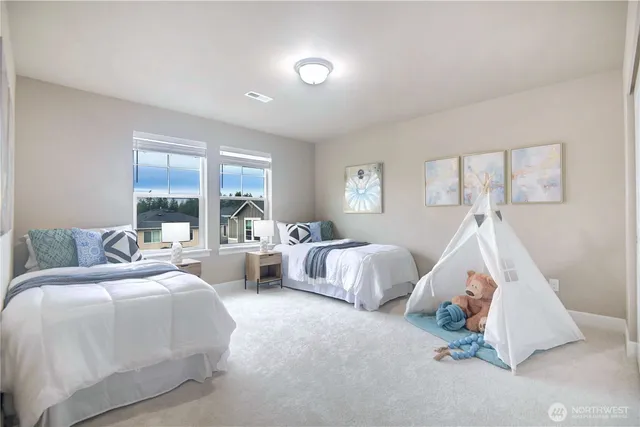 a bedroom with bed and window