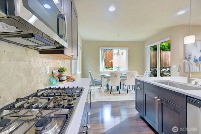 a kitchen with lots of counter top space and dining table