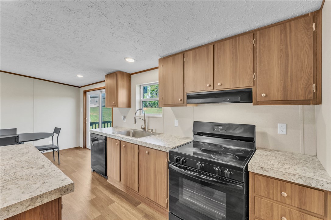 5303 Highway 413 Iva, SC 29655 - Photo 10 of 27 This spacious kitchen offers ample cabinet space and modern appliances for everyday living.