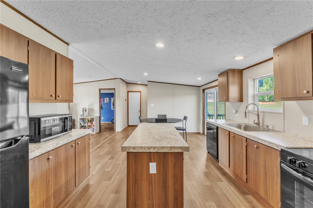 5303 Highway 413 Iva, SC 29655 - Photo 11 of 27 Bright and open kitchen with ample counter space and natural light, perfect for culinary endeavors.