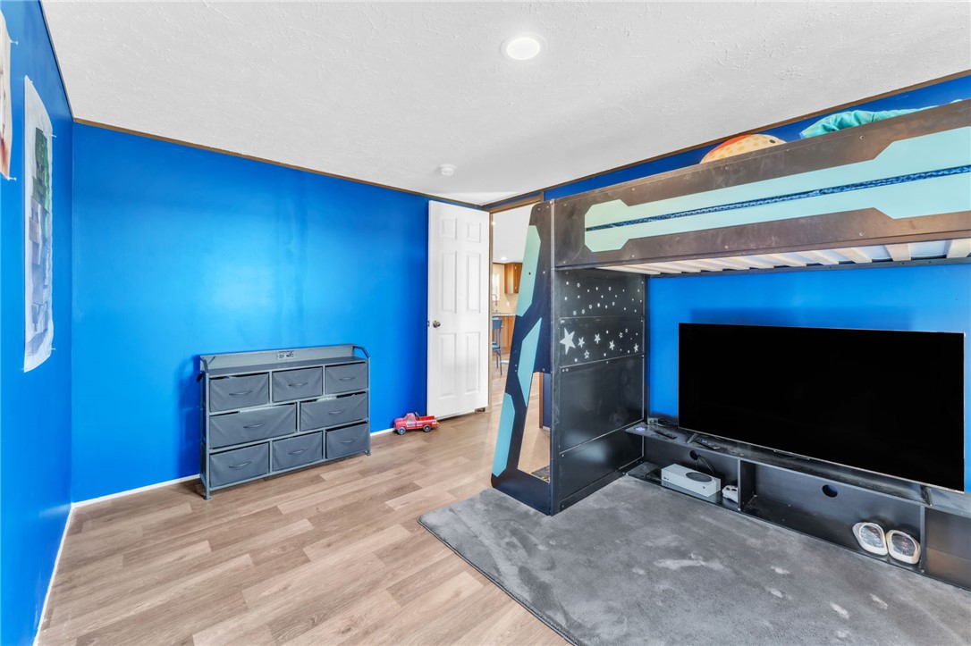 5303 Highway 413 Iva, SC 29655 - Photo 13 of 27 This spacious bedroom offers comfortable living with ample floor space and bright illumination.