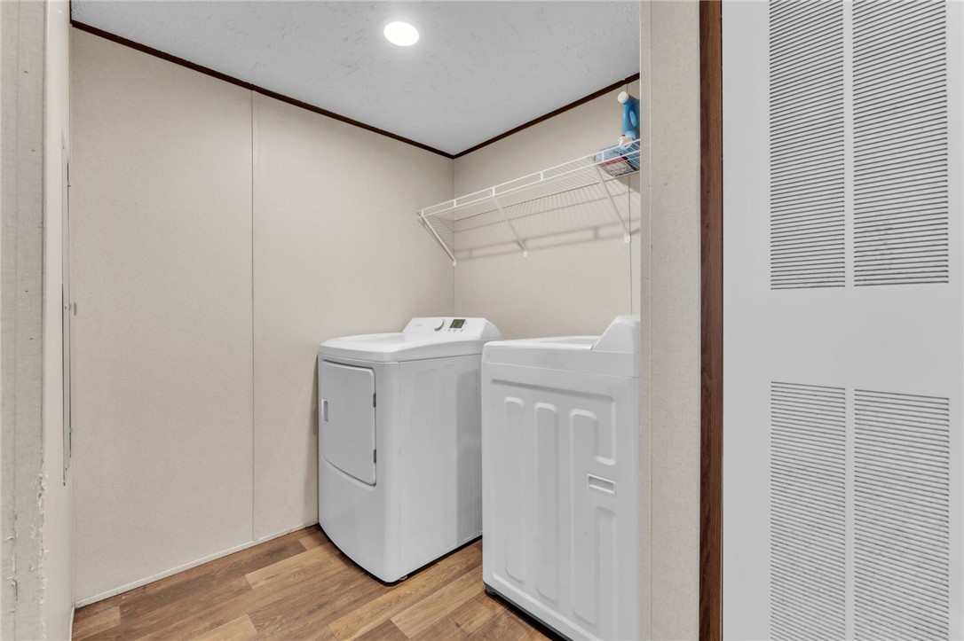 5303 Highway 413 Iva, SC 29655 - Photo 18 of 27 This dedicated laundry room offers convenient appliances and practical storage solutions.