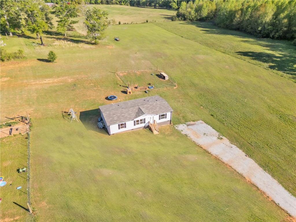 5303 Highway 413 Iva, SC 29655 - Photo 20 of 27 Expansive outdoor property with a charming residence, surrounded by lush green landscapes.