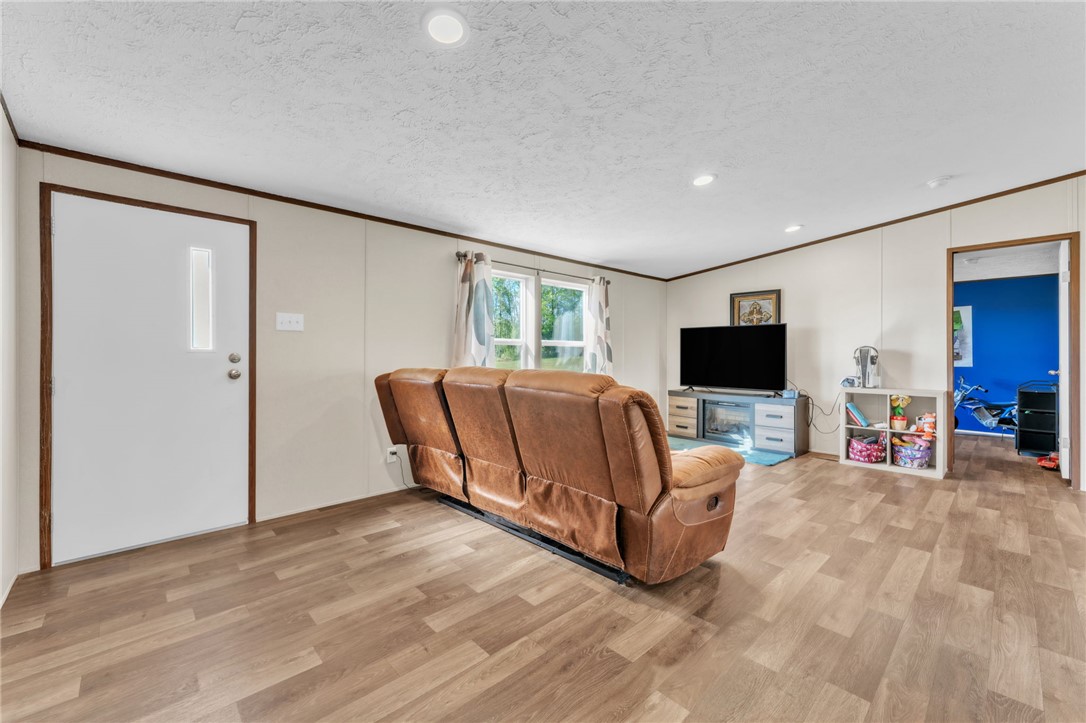 5303 Highway 413 Iva, SC 29655 - Photo 4 of 27 This bright living space features durable flooring and ample natural light, ideal for comfortable daily living.