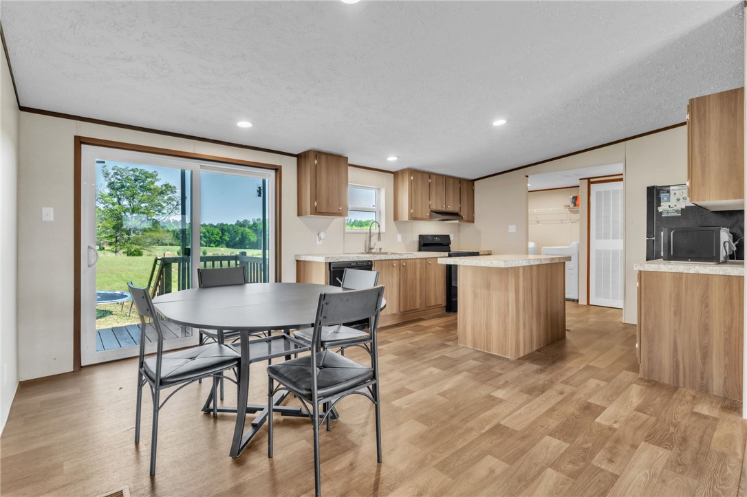 5303 Highway 413 Iva, SC 29655 - Photo 27 of 27 This kitchen and dining area features an open floor plan with ample natural light.