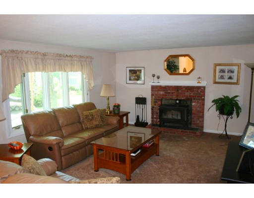 5 Brady Rd Extension Westborough, MA 01581 - Photo 8 of 16 a living room with furniture a window and a fireplace