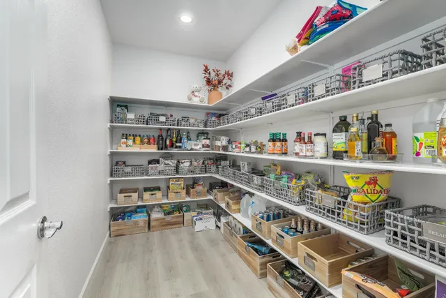 a storage room with stainless steel appliances