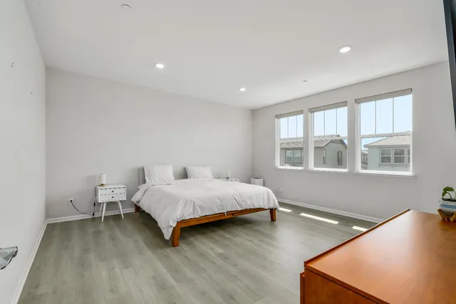 a bed room with a bed and window