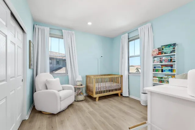 a living room with furniture and a book shelf