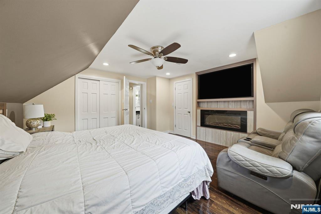 52 Barbara Drive Pompton Lakes, NJ 07442 - Photo 17 of 30 a spacious bedroom with a bed and a flat screen tv