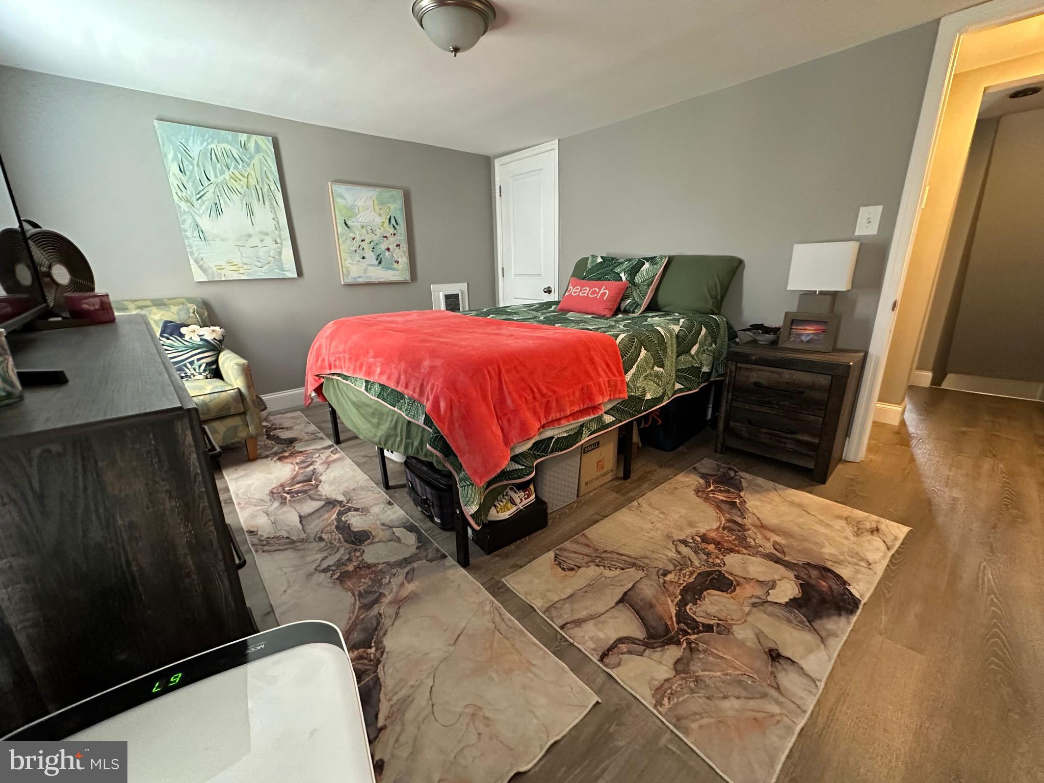 203 Mill Street Mount Holly, NJ 08060 - Photo 15 of 19 a bed sitting in a bedroom next to a window