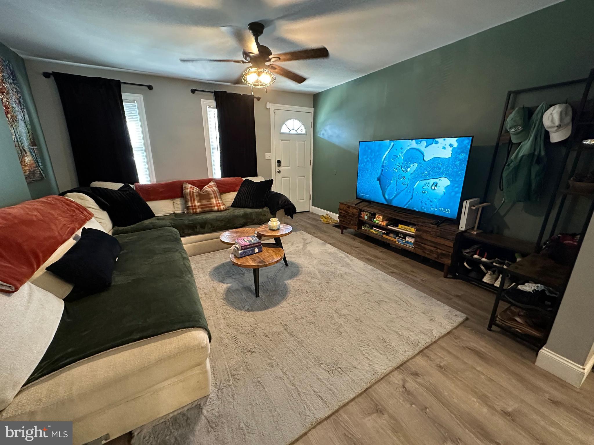 203 Mill Street Mount Holly, NJ 08060 - Photo 2 of 19 a living room with furniture and a flat screen tv