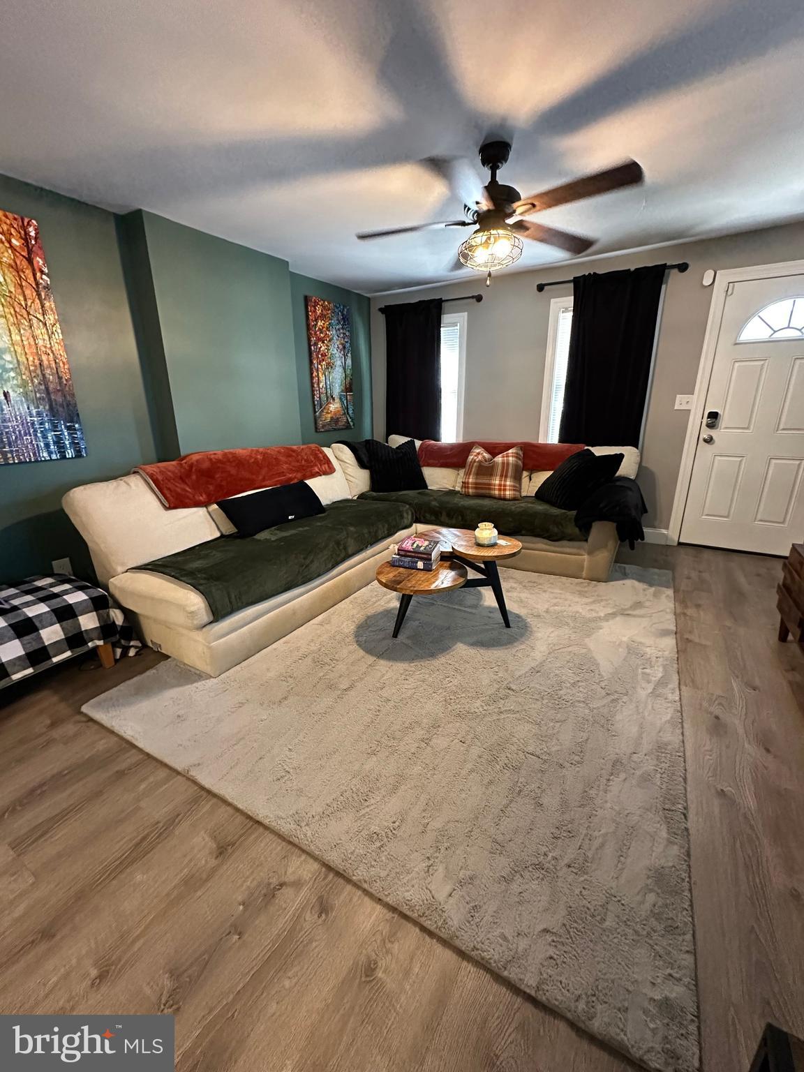 203 Mill Street Mount Holly, NJ 08060 - Photo 3 of 19 a living room with furniture and a flat screen tv