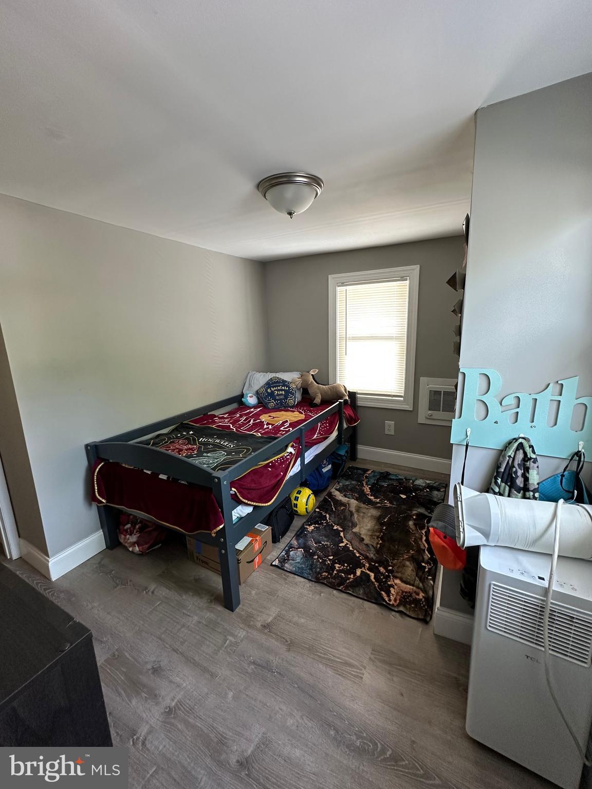 203 Mill Street Mount Holly, NJ 08060 - Photo 9 of 19 a bedroom with furniture and a wooden floor