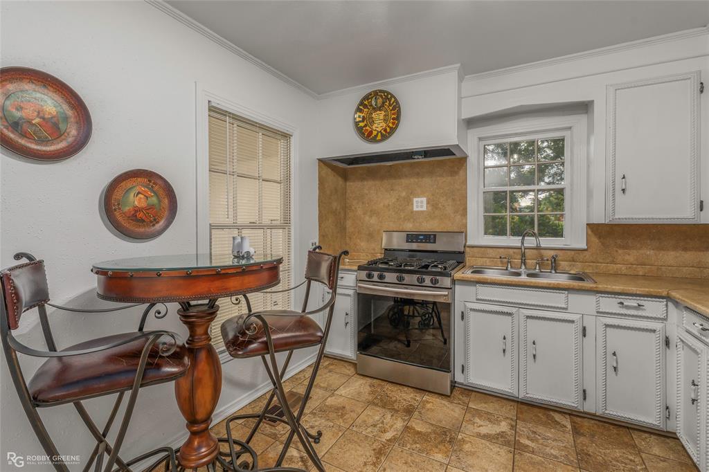 515 Davis Street Minden, LA 71055 - Photo 3 of 28 a view of a kitchen area with furniture and stove