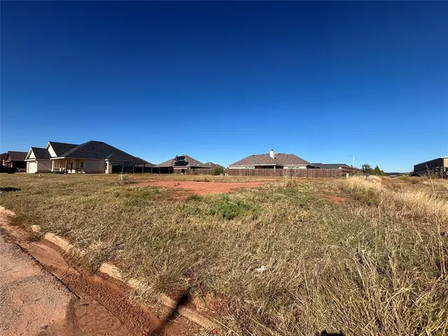 a view of mountain with sunset in background