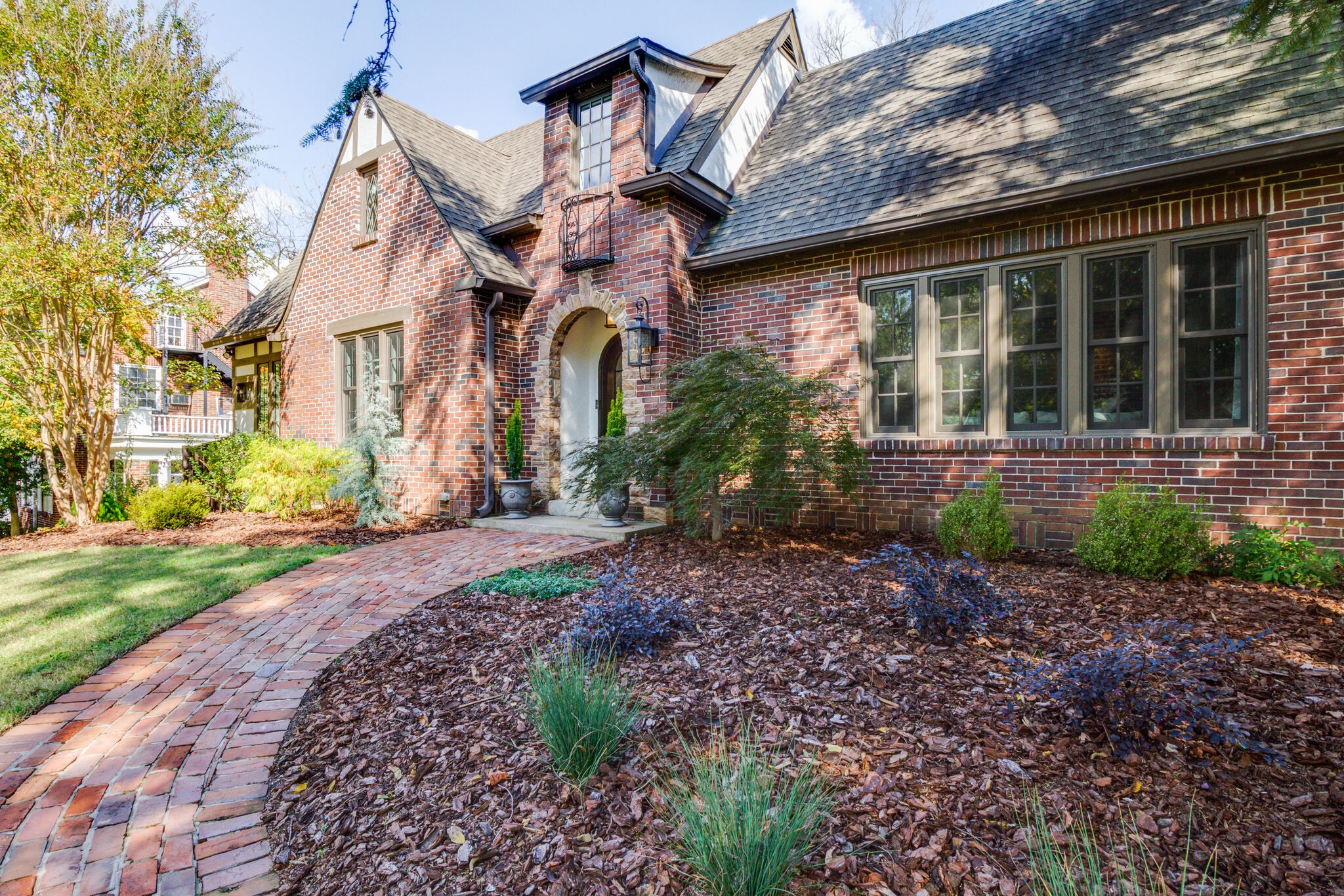 a front view of a house with garden