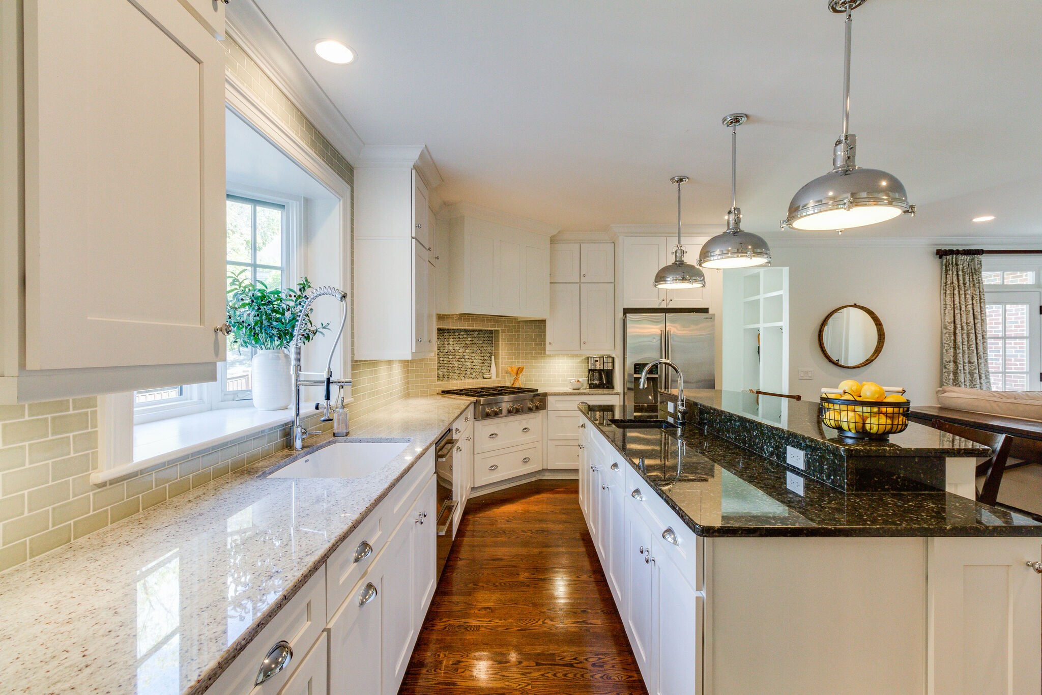 116 Mockingbird Road Nashville, TN 37205 - Photo 20 of 43 a large kitchen with kitchen island a large counter space a sink a window and stainless steel appliances