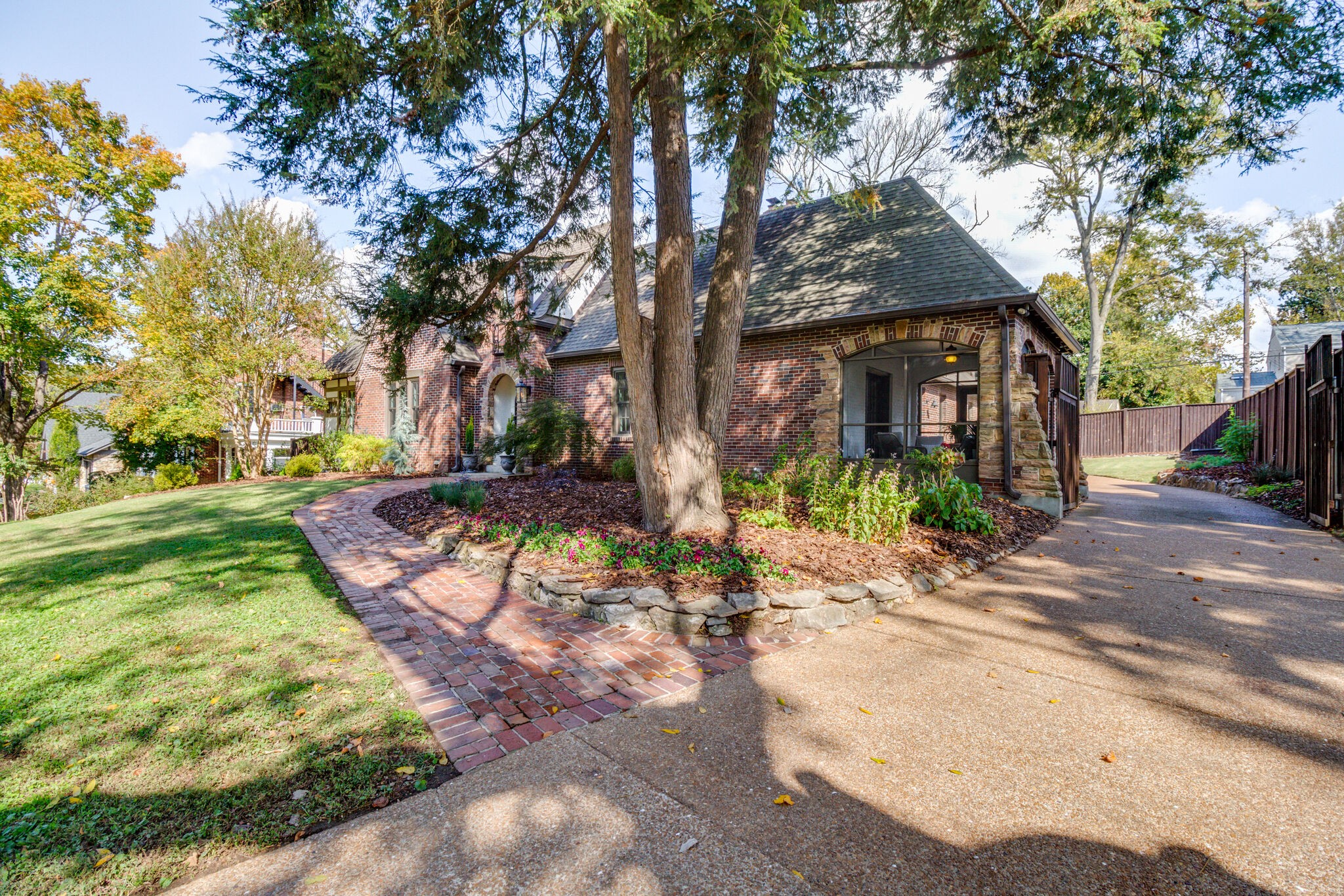 116 Mockingbird Road Nashville, TN 37205 - Photo 3 of 43 a view of a yard with plants and trees
